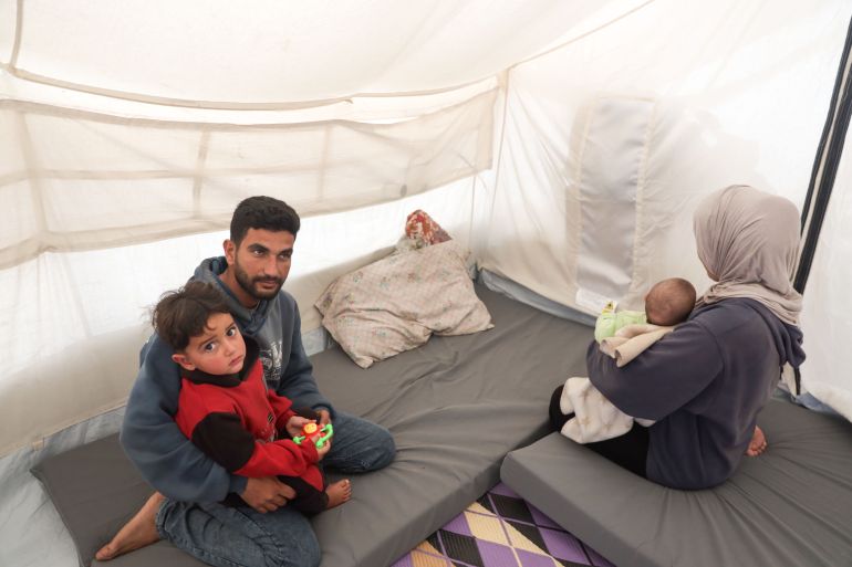 Gaza families rely on phone lamps as war destroys power grid.
