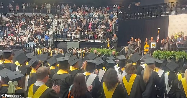 Hunter Metcalf accepts posthumous diploma for slain twin brother